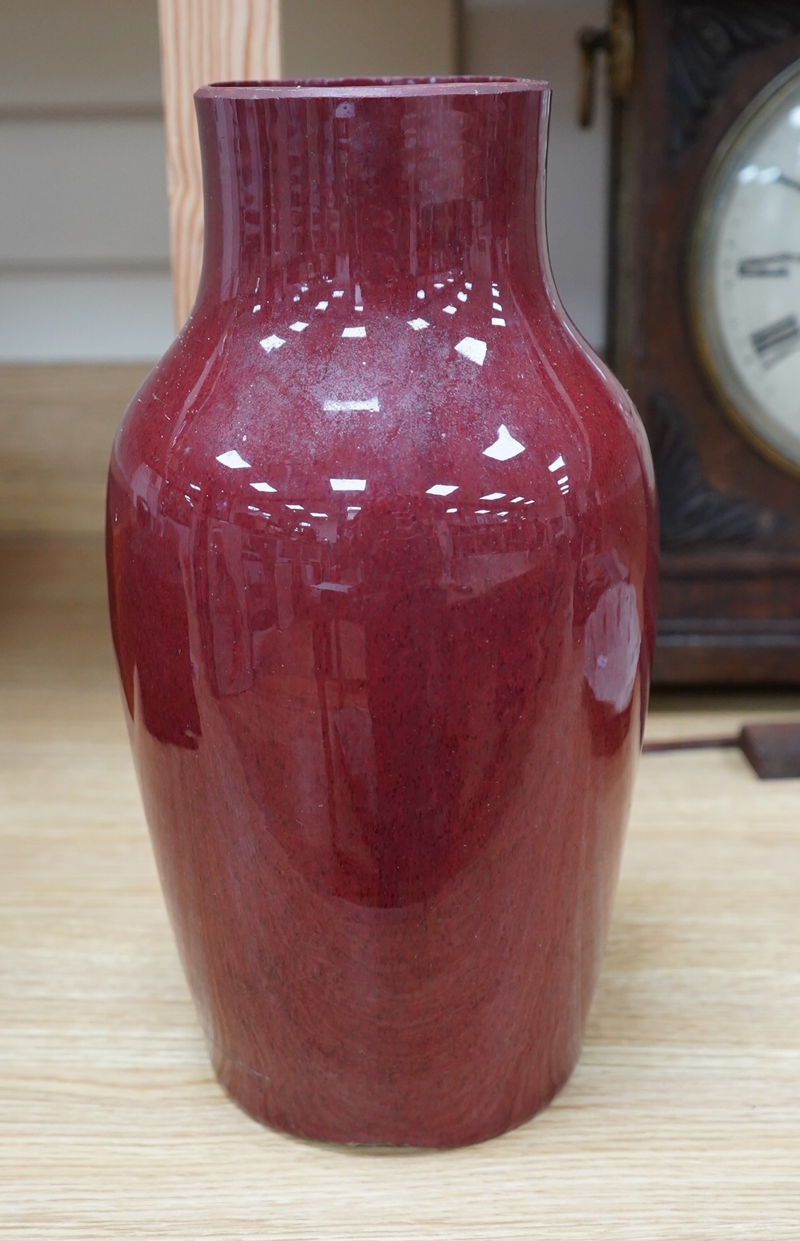 An 18th century Chinese sang de boeuf glazed vase, 34cm. Condition - ground down